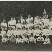 B+W photo of Our Lady of Grace School group photo of girls & boys with Mabel Bolles, Hoboken, n.d., ca. 1907.