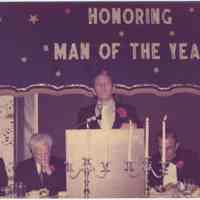 Digital image of color photo of Mayor Steve Cappiello at podium for a dinner honoring a Man of the Year, Hoboken?, no date, ca. late 1970