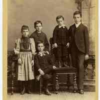 Cabinet photo of 5 children posed in photographer