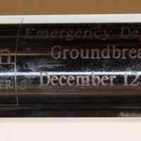          engraved plate at center
   