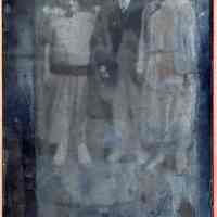 Tintype photo of a man, possibly J. Widmann with two woman (also possibly family members), no place, no date, ca. 1900.