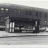 B+W photo of newstand on Hudson Place west of PATH street entrance, Hoboken, n.d., ca.1960s.