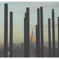 Color photo of pilings for Pier C Park with New York City in the background, Hoboken, Jan. 2008.