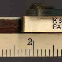         detail lower edge, left end & markings on indicator
   