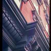 Color slide of detail view of cornice, bracket and pediments at 219 11th on the SE corner of 11th and Park