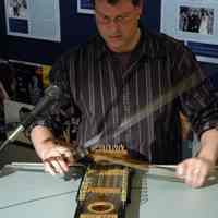 Digital images, 6, of Bob Buzas playing ukelin as part of lecture for exhibit, Hoboken Tunes, HHM, Hoboken, Sept. 15, 2007.