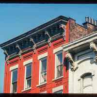 Color slide of detail view of cornice, brackets, frieze and brickwork at an unidentified location