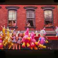 Color slide of people looking out of windows.