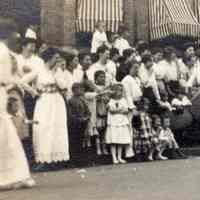          detail left: crowd watching
   