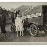 Two Women Standing in Front of Hoboken Individual Laundry Truck