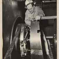 B+W photo of man working on a shaft at Bethlehem Steel Shipyard, Hoboken, n.d., ca. 1960s.