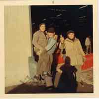 Image: color photo of three longshoremen 