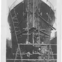 B+W photo of a heads-on view of bow repairs to the S.S. Norfolk in dry dock, Hoboken, no date, ca. 1940.