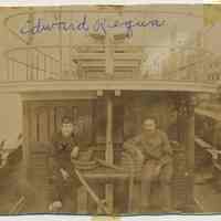 Sepia-tone photo of Edward Requa & a man aboard tugboat, Hoboken?, n.d., ca. 1900-1910.
