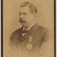 Cabinet photo of man in fine dress wearing Odd Fellows medal, Hoboken, n.d., ca. 1875-1887.