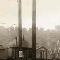          detail left: crossing gatehouses, poster on pole
   