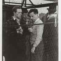 B+W publicity photo of Marlon Brando as Terry Malloy with director Elia Kazan on the set of film "On the Waterfront," Hoboken, no date, ca 1953-54.