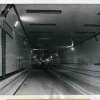          image: Lincoln Tunnel at state-line marker prior to opening, Nov. 1937
   