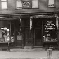          photo 2, detail center: J. Rondinone, Barber; candy store; Louis Violone
   