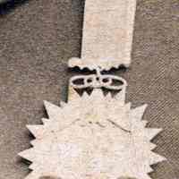          detail medal: Odd Fellows ring symbol; scales of justice
   