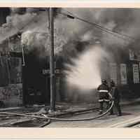 B+W photo of firemen fighting fire at Observer Hwy. & Monroe St. [558 Newark St.], Hoboken, May 11th, ca. 1983-1988.