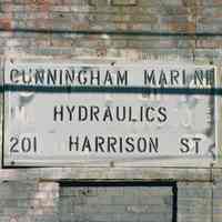 Color photo close-up of wall sign for Cunningham Marine Hydraulics, 201 Harrison Street at 2nd Street, Hoboken, Jan. 3 & 4, 2002.