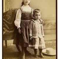 Cabinet photo of a girl & boy (related to Great-Grandmother Lancy) posed in photographer