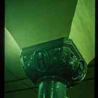 Color slide of interior detail view of a column with a capital reading "H" in the Hoboken PATH station on Hudson Place and River Street