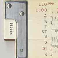          detail back left end with serial number; scales
   