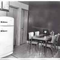          008 Kitchen with refrigerator, kitchen table and chairs.
   