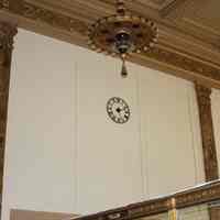          027 east wall of main room with clock, hanging chandelier & wall detail
   