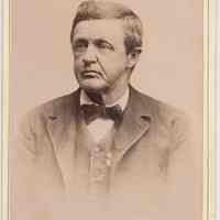 Cabinet photo of middle aged man posed in photo studio, Hoboken, n.d., ca. 1885-1892.