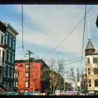          Color slide of eye-level view of row houses on Bloomfield looking N from the SE corner with 11th picture number 1
   