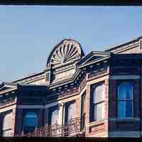          Color slide of close-up view of pediments, cornice, bay windows and fire escape at 106 11th on the NE corner with Bloomfield picture number 1
   