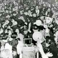 B+W copy photo of Frank Sinatra in a crowd in front of Hoboken City Hall, Oct. 30, 1947.