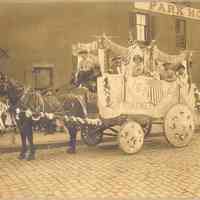 Sepia-tone photo of decoration on union parade wagon by United Decorating Co., Hoboken, n.d., ca.1907-1915.