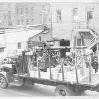 B+W photo of an artillery gun loaded on a truck below Classification Surveyor