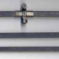          three tubular bars; top with fixed holder at left & micrometer screw
   