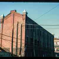 Color slide of eye-level view of unidentified industrial building on Observer Highway near Washington