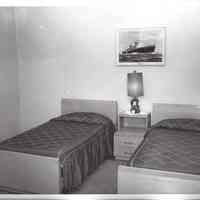          011 Master bedroom with twin beds; ship print.
   