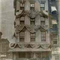Sepia-tone photo of exterior of August Moos, Hotel & Restaurant, 200 River St., Hoboken, decorated for grand opening, ca. 1905-1910.