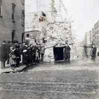 Sepia-tone photo of a promotional snow structure re mayoral candidate or parody?, near 106 -108 Madison St., Hoboken, n.d., ca. 1913-1918.
