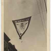 B+W photo of victory flag or banner hanging in the 100 block of Willow Ave., Hoboken, Aug, 1942.