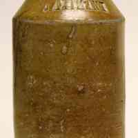 Bottle: J. Axtmann; embossed glazed stoneware. Hoboken, n.d., ca. 1860-1880.