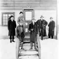 Color copy photo of B+W photo of winter view of six men standing outside the Lawson & Macmurray Lumber Co. office, Hoboken, no date, ca. 1934-35.