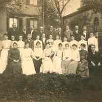 Sepia-tone group photograph of the Concordia Church Choir in the backyard of the rectory of the German Evangelical Church, Hoboken, September, 1903.