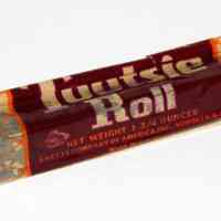 Tootsie Roll, Chocolate Flavor candy; large; original printed wrapper. Made by Sweets Co. of America, Hoboken, N.J. N.d., ca. 1950-1960.