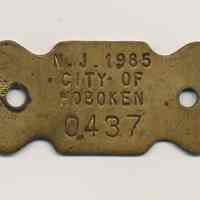 Dog license tag: N.J. 1985 City of Hoboken 0437.