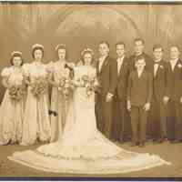 Sepia tone formal portrait of a wedding party in photographer