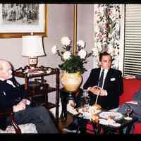 Color slide of three men in a room.